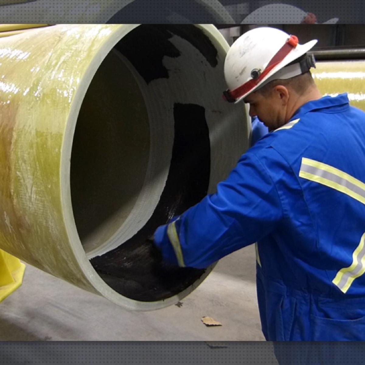 Adhesive being applied to fibreglass piping